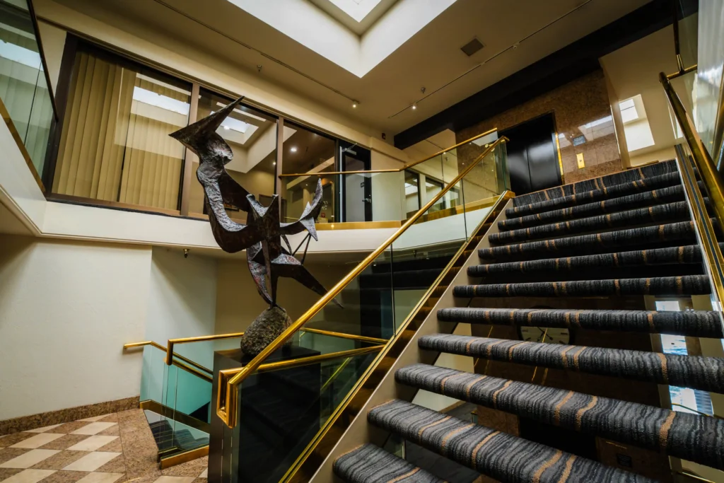 Metal sculpture near staircase in the 2300 Building