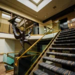 Metal sculpture near staircase in the 2300 Building