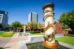 Vine-wrapped pillar fountain at Civic Center Square